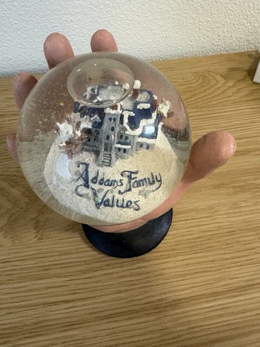 Addams Family Values Glass Snow Globe w/ Mansion Hand Base, Clear/Black/White