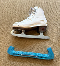 Figure Ice Skates Pair with Blue Blade Guards. Tape comes off. Size 12 1/2 kids