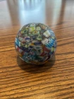vintage Murano glass paperweight featuring a multicolored millefiori pattern