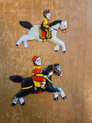 two vintage Cracker Jack tin horse jockey