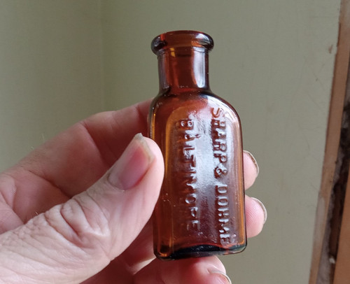 SHARP & DOHME BALTIMORE EMB WITH LABELS AMBER 3 SIDED POISON BOTTLE