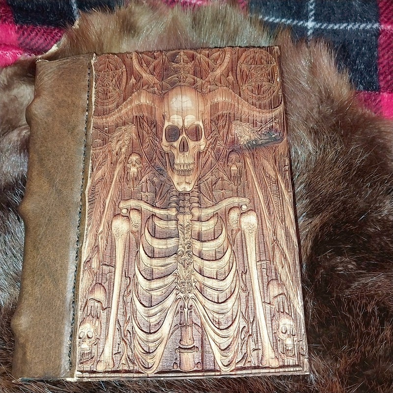 BOOK OF SPELLS "OLD LOOKS HAND BOUND" WOOD COVERS WITH ENGRAVINGS VERY UNIQUE.