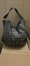 Bebe black hobo bag w/ silver-tone grommet & eyelet embellishments on the front