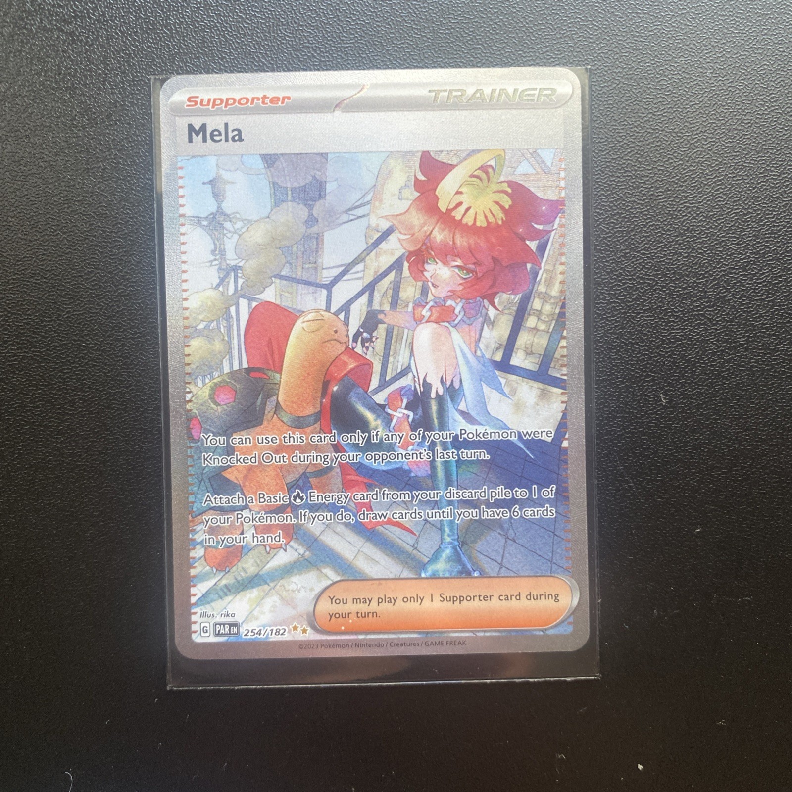 Mela 254/182 SV04: Paradox Rift Holo Trainer Pokemon Card