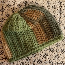 hand-crochet beanie in shades of green, brown, and olive green