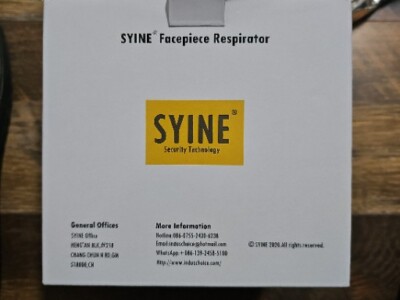 Syine facepiece respirator with filters and safety glasses