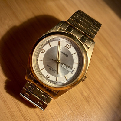 Armitron Men's Quartz Day/Date 100m Gold Tone Bracelet Watch Silver Dial