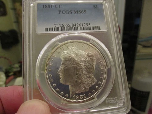FULL GEM GRADED 1881-CC MORGAN DOL  PCGS MS 65   ALMOST PL SURFACES
