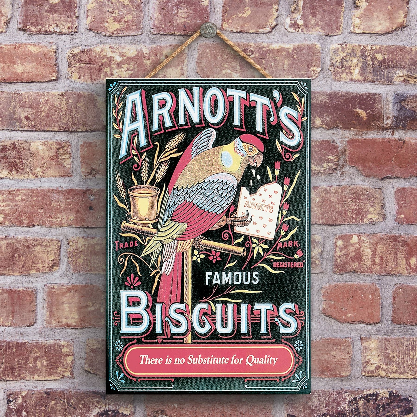 A CLASSIC ARNOTT'S FAMOUS BISCUITS BIRD  VINTAGE AD ON A WOODEN PLAQUE