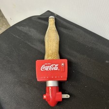 COCA COLA SPARKLE NIGHT LIGHT, COKE BOTTLE SITTING ON ICE CHEST WITH SPARKLES