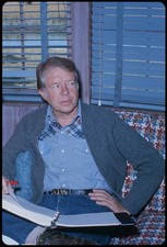 Photo:President Jimmy Carter 1977-1981 sitting at desk with notebooks