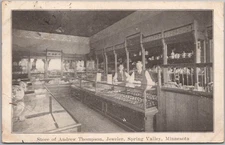 1908 SPRING VALLEY, Minnesota Postcard "Store of Andrew Thompson, Jeweler"