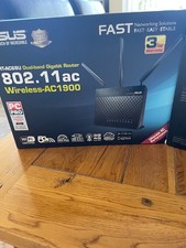 Two ASUS RT-AC68U Dual Broadband Gigabit Routers in original packaging