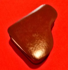 Musical movement box in the shape of a grand piano covered in brown faux leather