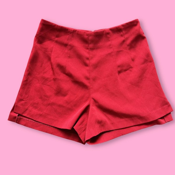 High-waisted red shorts with a clean, structured silhouette.
