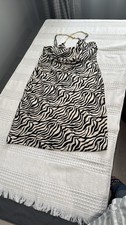 Guess Black and White Sheath Cocktail Size: M Guess Elevate your evening look