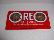 4 METAL SIGN OREO COOKIES, CRACKER JACK, REESES CUPS, HERSHEYS KISSES, CANDY