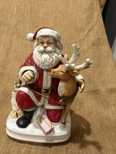 Vintage  Melody In Motion Musical Rudolph Reindeer Santa Claus Figurine 1996