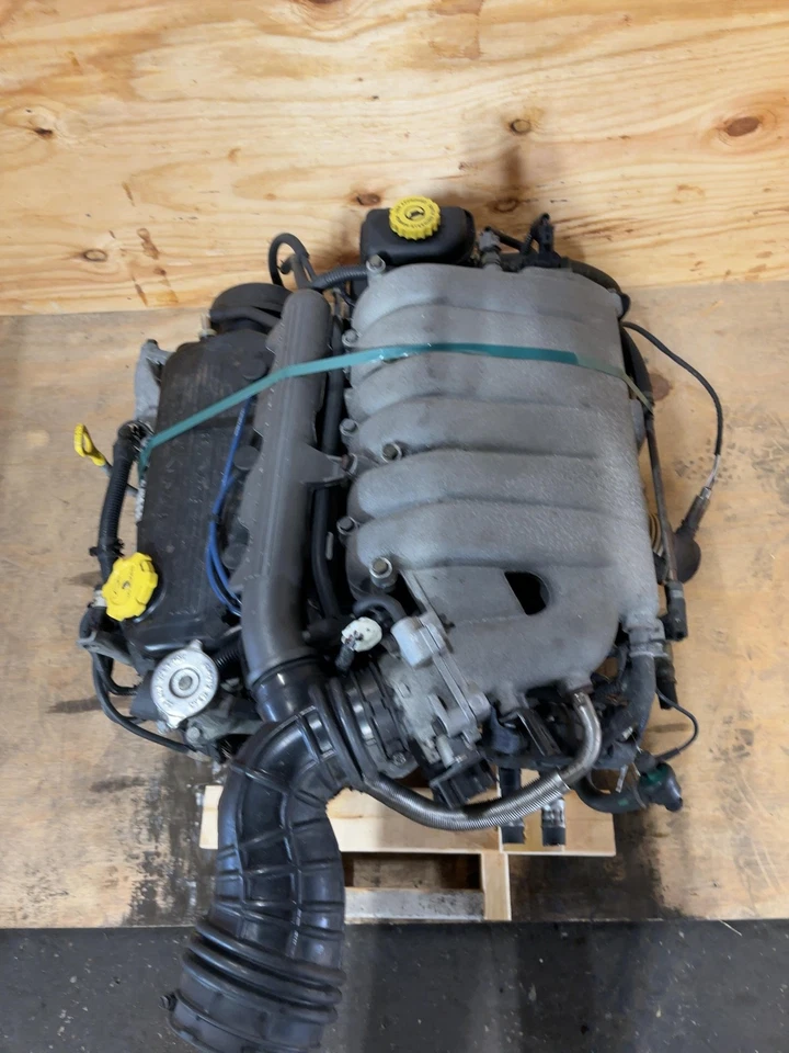 98 99 00 SEBRING Conjunto de motor/motor 6-153 (2,5 l) Conv (vin H 8º dígito) Foto 3 de 4