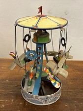 Giostra in latta made in Germany 1900 con bambini e con Aeroplani