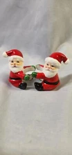 VINTAGE PAIR CHRISTMAS SANTA 2 1/4" HIGH CANDLE HUGGERS / CLIMBERS!