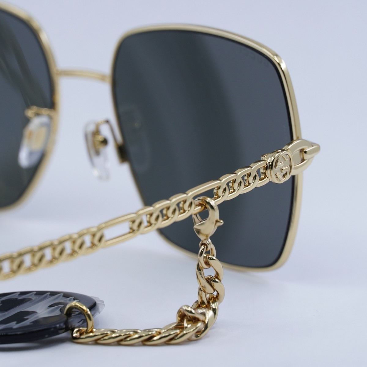 GUCCI GG0724S 001 Gold with Black GG Logo on Gold Chain/Grey