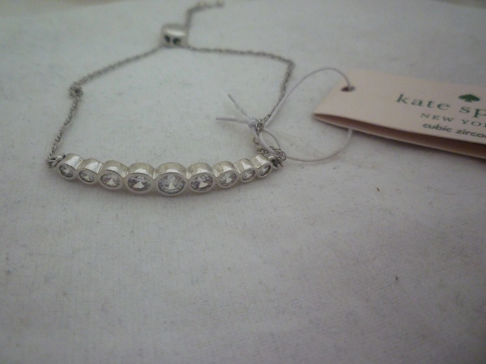 Bracciale Kate Spade cerchio completo scorrevole trasparente argento con zirconi nuovo