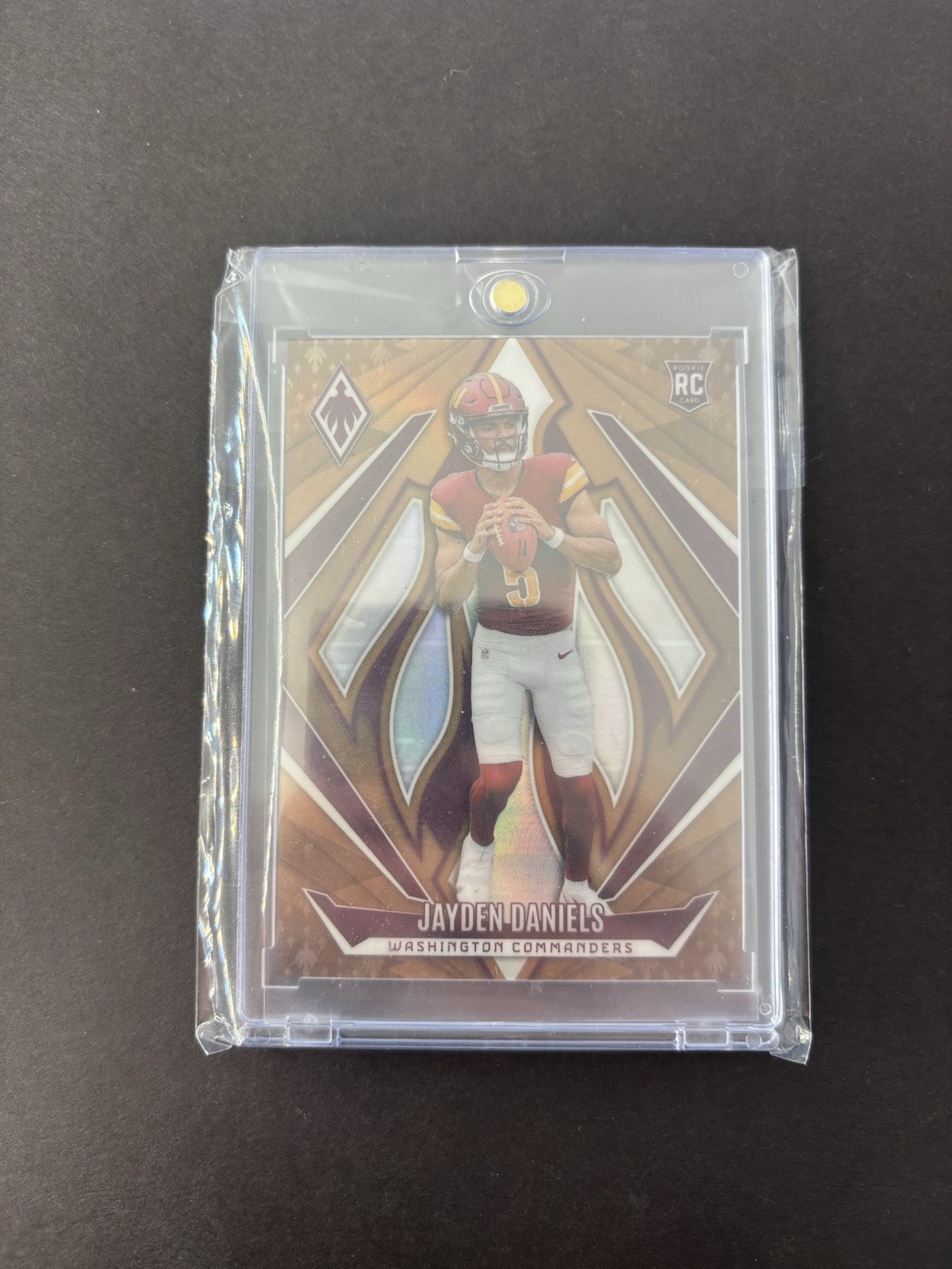 2024 Panini Phoenix - Rookies Jayden Daniels #198 Bronze /75 (RC)