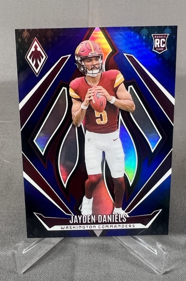 2024 Panini Phoenix - Rookies Jayden Daniels #198 Blue Fade /249 (RC)
