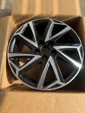 Genuine Volkswagen OEM alloy wheel.  Diamond cut face with gloss black inserts.
