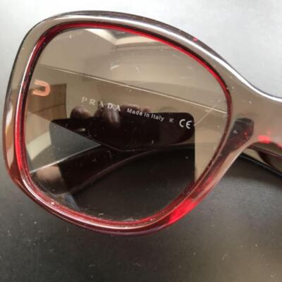 PRADA ビジュー付きレッドサングラス PRADA Sunglasses with Triangle Logo Plate Clear Red From