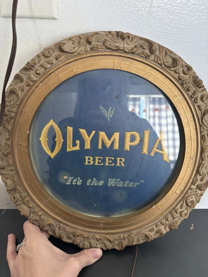 Letrero eléctrico vintage de estrellas centelleantes animadas de cerveza Olympia Foto 3 de 4