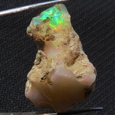 NATURAL PLAY OF COLOR ETHIOPIAN OPAL ROUGH GEMSTONE 19.15 Cts. (18x24x12 mm)L_97