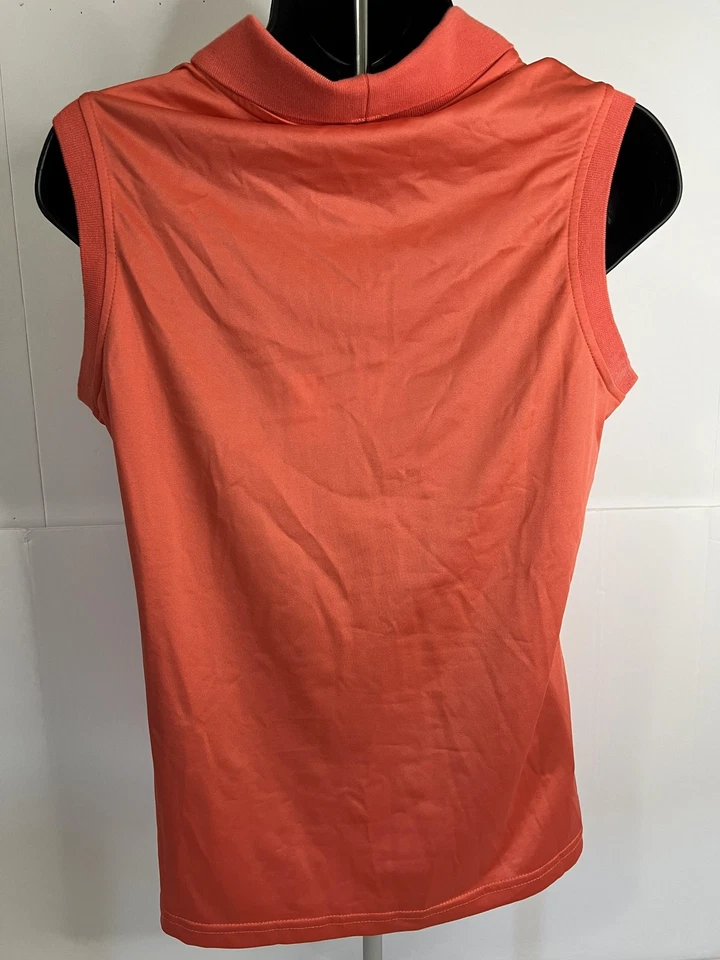 Camisa Polo Antigua Para Mujer Mediana Coral Sin Mangas Golf Aproximación Elastizada Atlética Foto 3 de 4