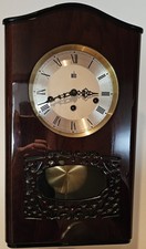 orologio da parete vintage Melux a pendolo