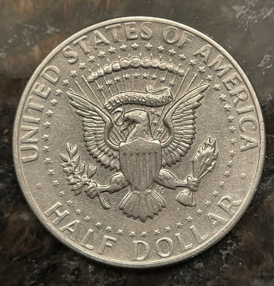 ungraded-1972-d-half-dollar-coin-with-fg-initials-and-doubled-binded