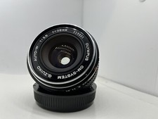 Olympus OM Systems G.Zuiko Auto W 28mm f/3.5 Lens W/ Lens Caps