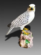 Highly realistic, true-to-size Gyrfalcon bird carving
