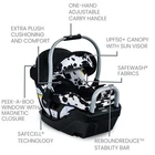 Black and white cow-print Britax Willow SC infant car seat with canopy, adjustable handle, and safety features.