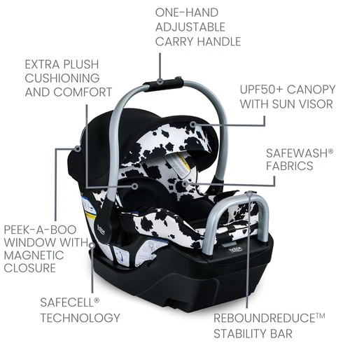 Black and white cow-print Britax Willow SC infant car seat with canopy, adjustable handle, and safety features.