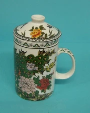 Tea cup with , lid and infuser birds,  flower pattern.