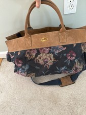 Floral tapestry bag with leather trim, interior pocket and a zippered pocket