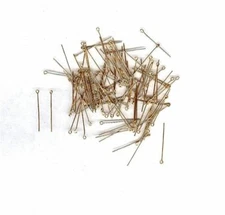 100 tiny brass eye pins. Great for doll houses.