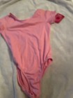BRAND NEW XILARATHION PINK SHORT SLEEVE GIRL LEOTARD SZ L 12-14 — photo 1
