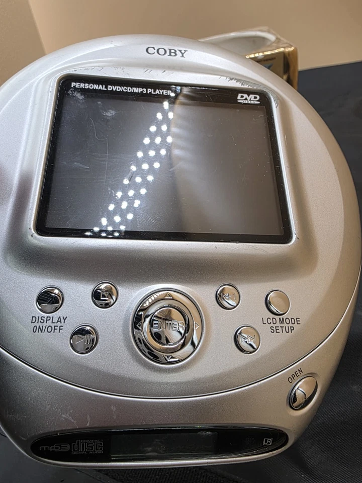 Reproductor de DVD ultra portátil Coby TF-DVD500/SIN cargador - PROBADO arañazos menores Foto 3 de 4