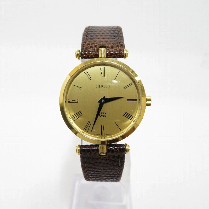 Montre Gucci analogique à quartz d'occasion dorée (cadran) marron (ceinture) F131