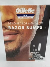 NEW IN BOX GILLETTE SKINGUARD RAZOR SET W 4 CARTRIDGES 1 SHAVE GEL 91952744