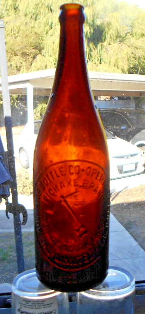 VINTAGE BROWN GLASS BEER BOTTLE ADELAIDE BOTTLING COOP PICKAXE DESIGN