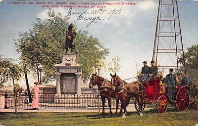 ST JOSEPH, MI, FIREMEN & EQUIPMENT POSE AT THEIR MEMORIAL MONUMENT, dated 1910