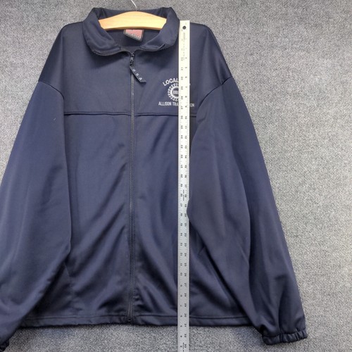 Blue men's full zip jacket with embroidered "Made in USA" text, 2XL size, shown beside a tape measure on white surface.